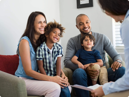 Diverse family with two small children at a counseling session