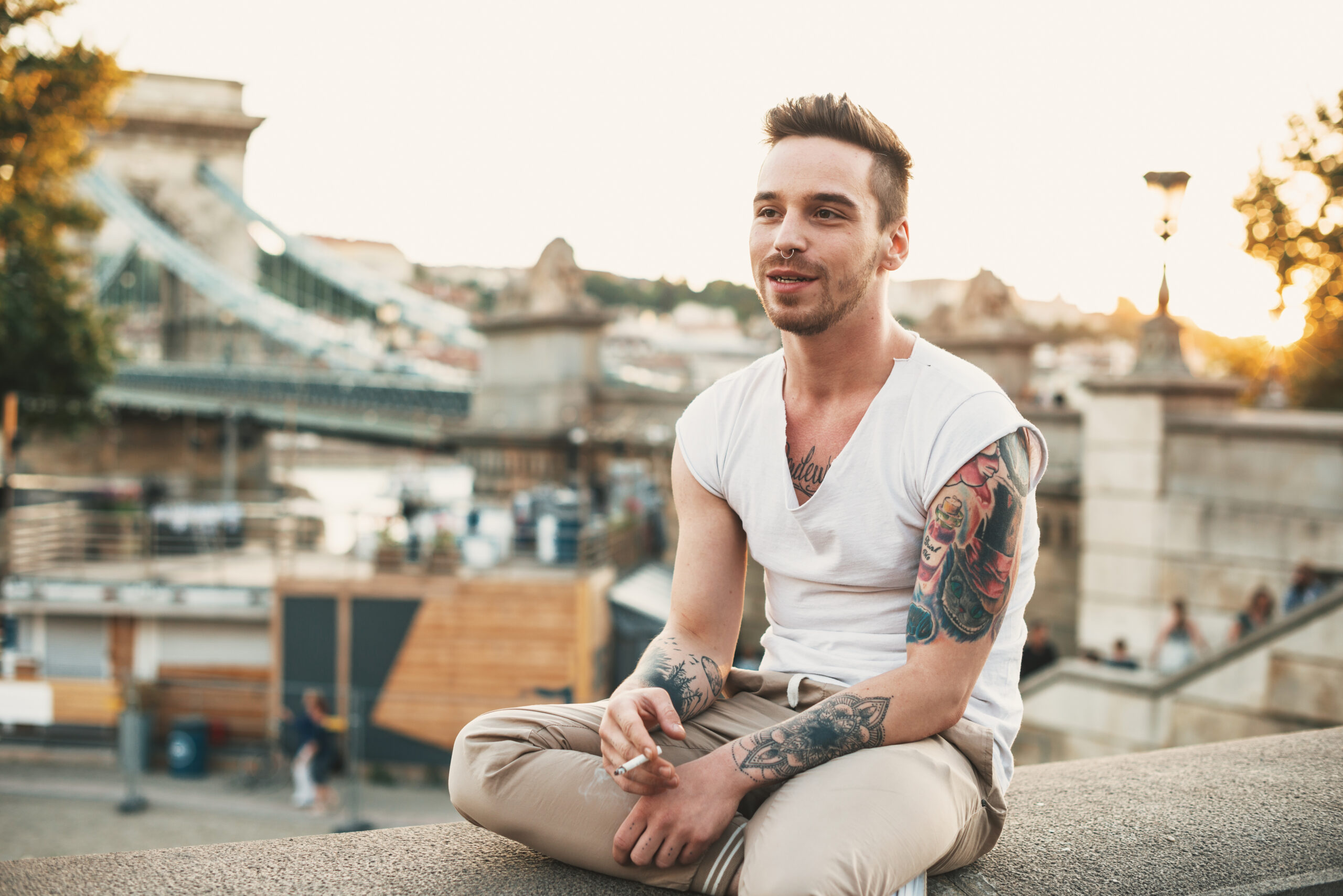 Portrait of handsome modern man with tattoos