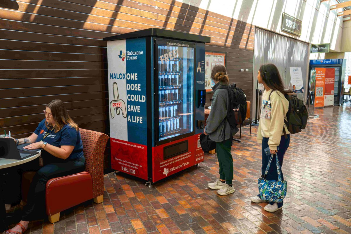 UT San Antonio Students look at a naloxone vending machine provided by Naloxone Texas
